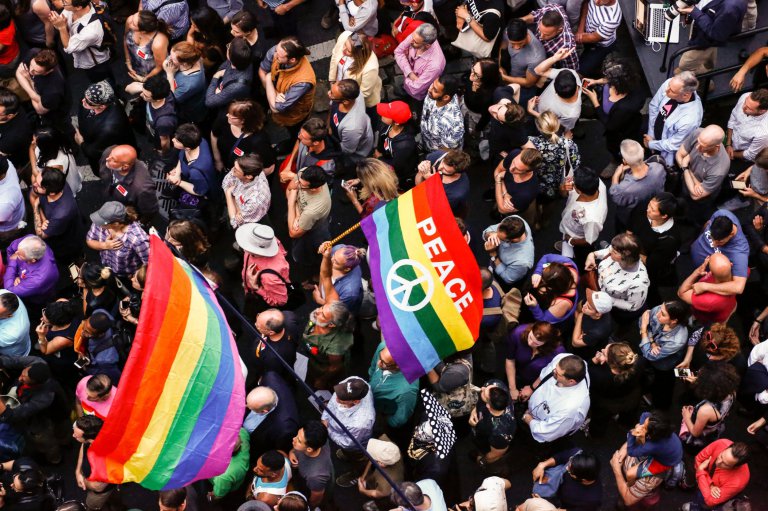 People gather at a vigil in solidarity for the victims killed at Pulse nightclub in Orlando in New York on June 13, 2016. The American gunman who launched a murderous assault on a gay nightclub in Orlando was radicalized by Islamist propaganda, officials said Monday, as they grappled with the worst terror attack on US soil since 9/11. / AFP PHOTO / KENA BETANCURKENA BETANCUR/AFP/Getty Images
